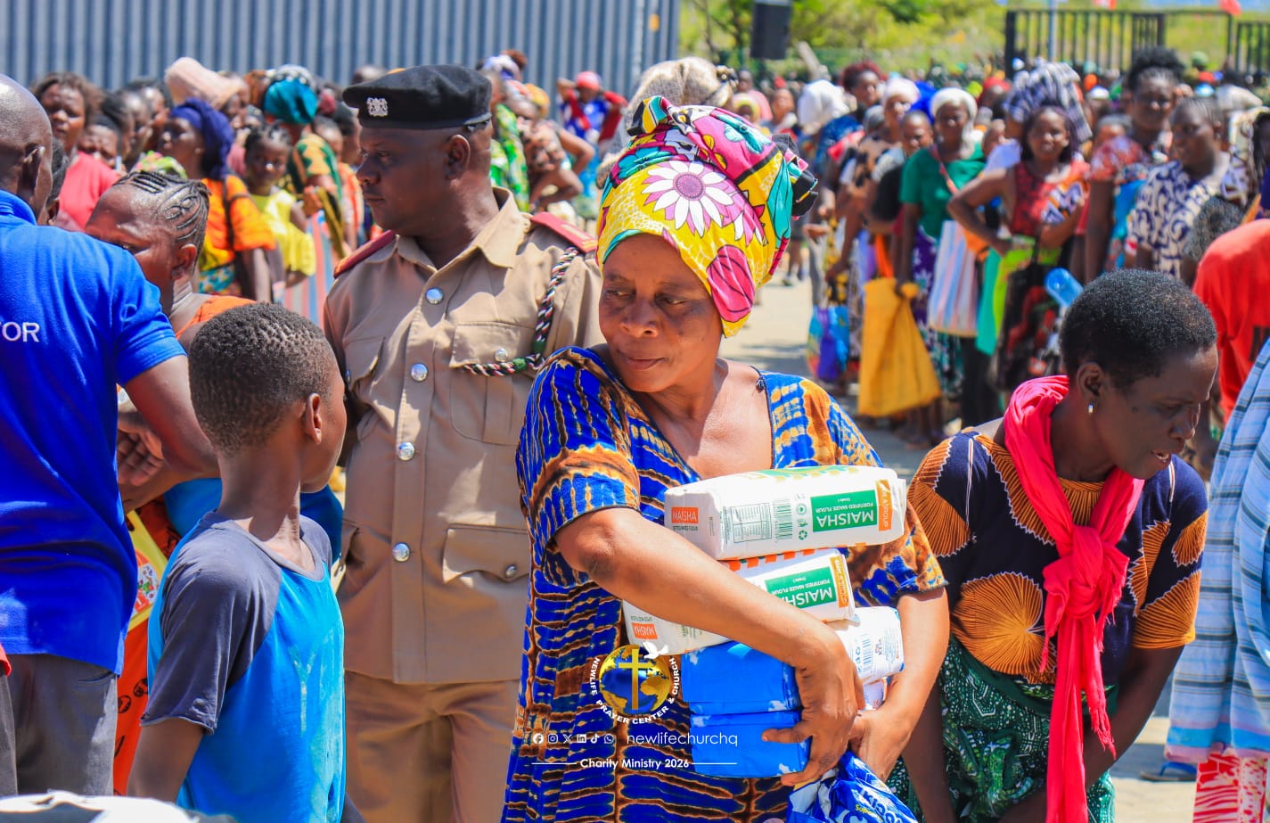 Woman receiving food supplies at charity event