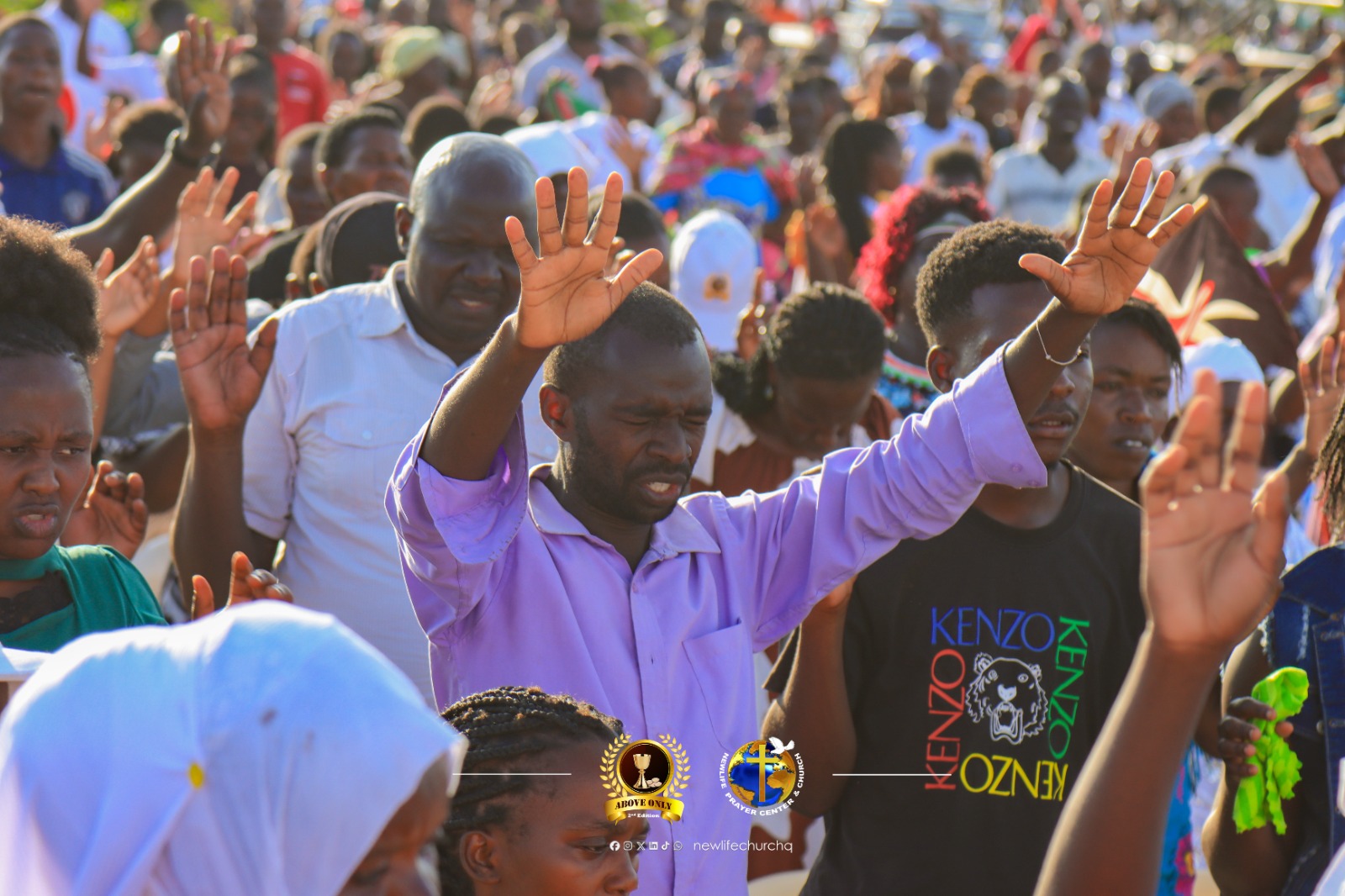 Congregation raising hands in prayer and deliverance
